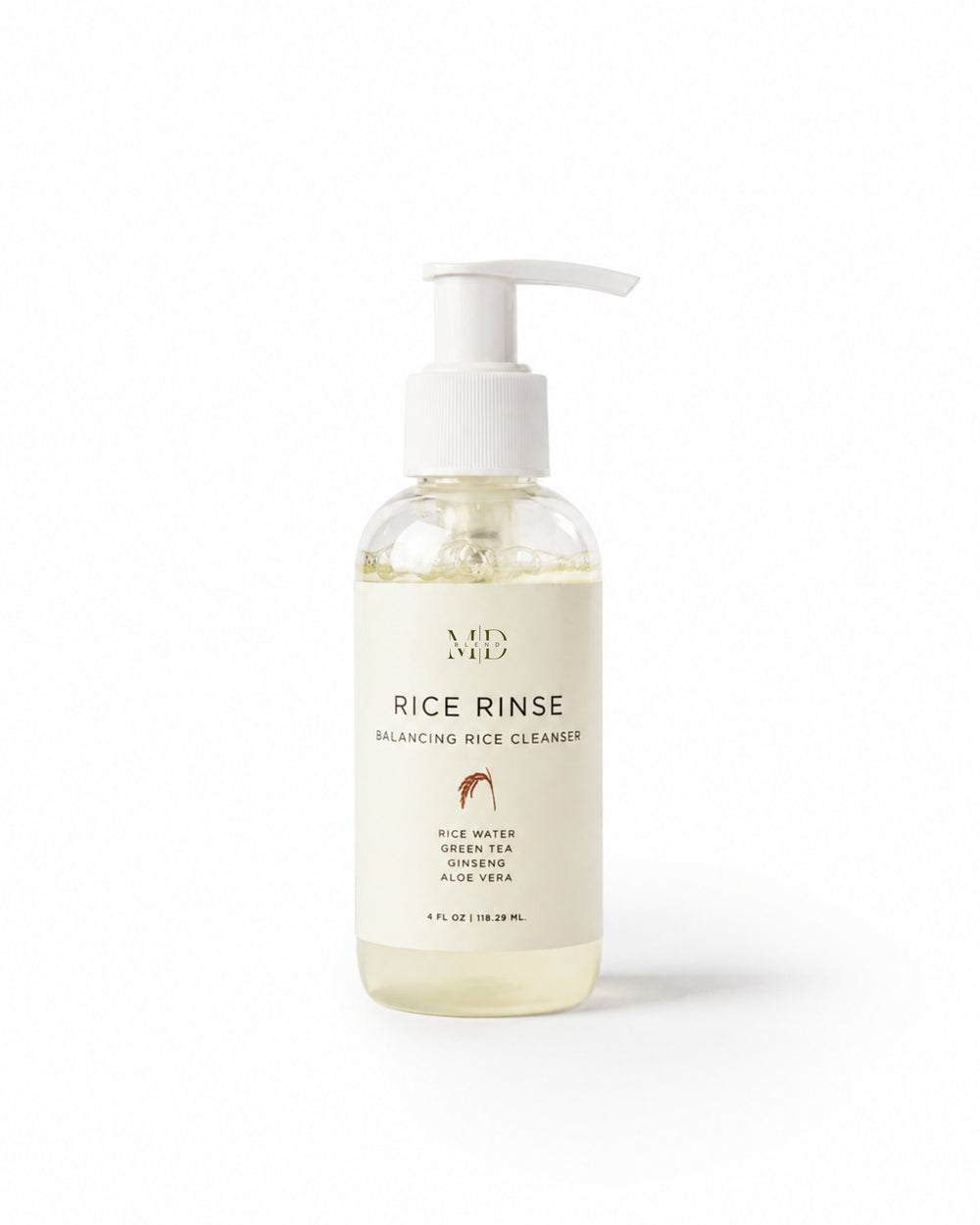 M.D. Blend Rice Rinse Balancing Rice Cleanser in a clear pump bottle, formulated with rice water, green tea, ginseng, and aloe vera for gentle daily cleansing and hydration.