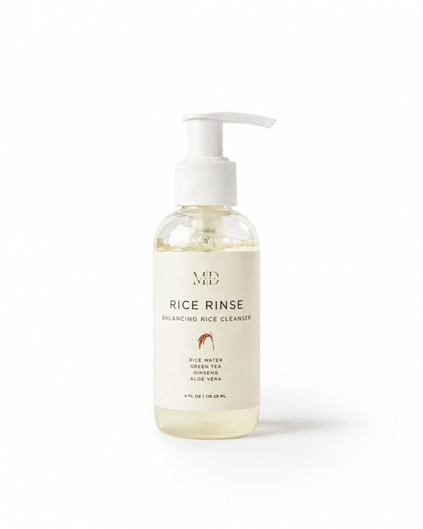 M.D. Blend Rice Rinse Balancing Rice Cleanser in a clear pump bottle, formulated with rice water, green tea, ginseng, and aloe vera for gentle daily cleansing and hydration.