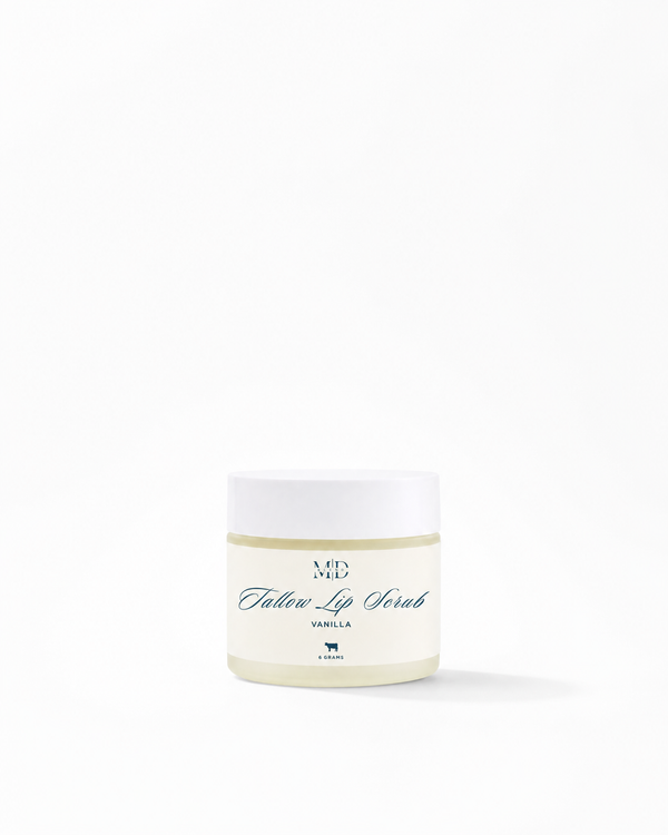 A small white jar of M.D. Blend Lip Scrub in Vanilla scent, set against a solid white background with a soft shadow.