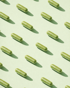 Pattern of green capsules on a light green background