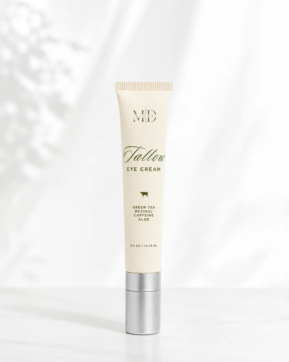 Tube of eye cream with visible branding on a white background