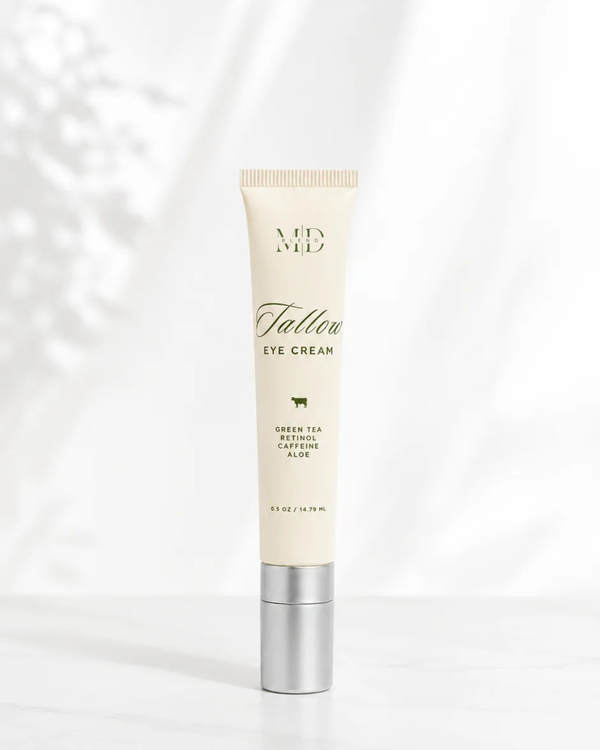 Tube of eye cream with visible branding on a white background